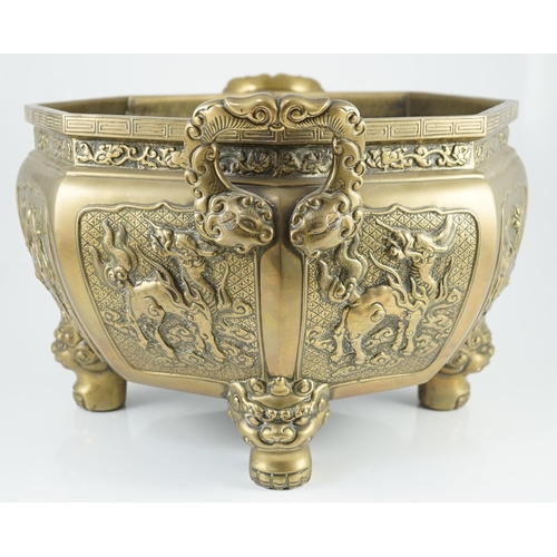 227 - A large Chinese polished bronze octagonal jardiniere, 19th century, each side cast in relief with a ... 