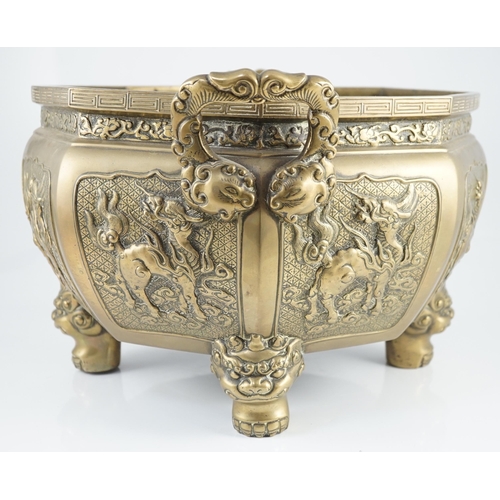 227 - A large Chinese polished bronze octagonal jardiniere, 19th century, each side cast in relief with a ... 