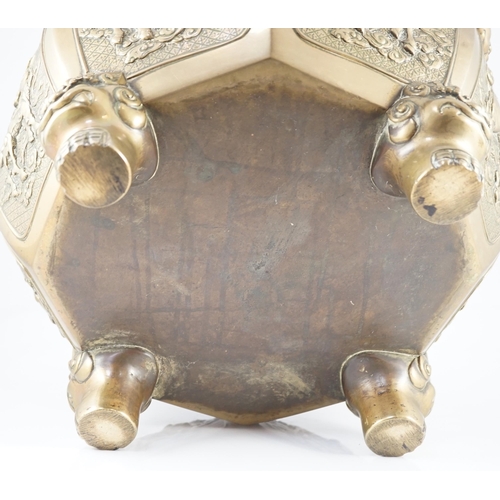 227 - A large Chinese polished bronze octagonal jardiniere, 19th century, each side cast in relief with a ... 