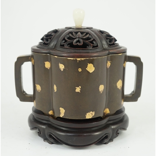 229 - A Chinese gold splashed bronze quatrelobed censer, dark brown patinated with gold splashes, applied ... 