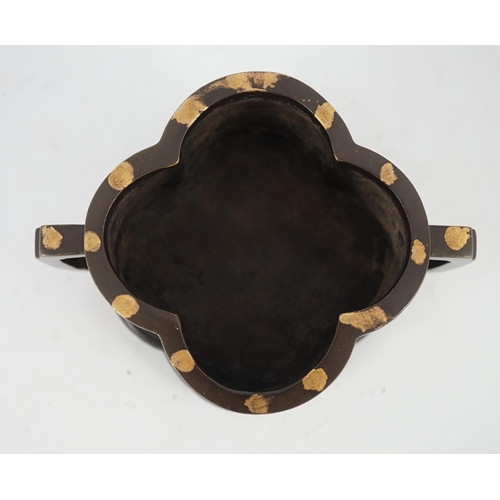 229 - A Chinese gold splashed bronze quatrelobed censer, dark brown patinated with gold splashes, applied ... 