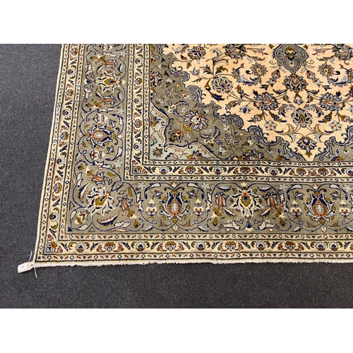 248 - A Kashan ivory ground carpet, with central lobed floral medallion within a conforming field and wide... 