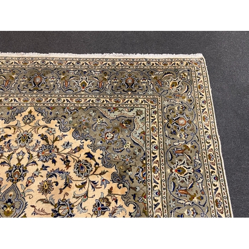 248 - A Kashan ivory ground carpet, with central lobed floral medallion within a conforming field and wide... 