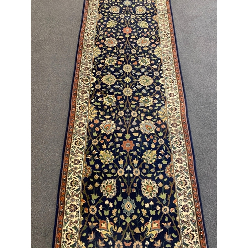 252 - A Bijar blue ground runner, with polychrome floral field, 464cm x 100cm