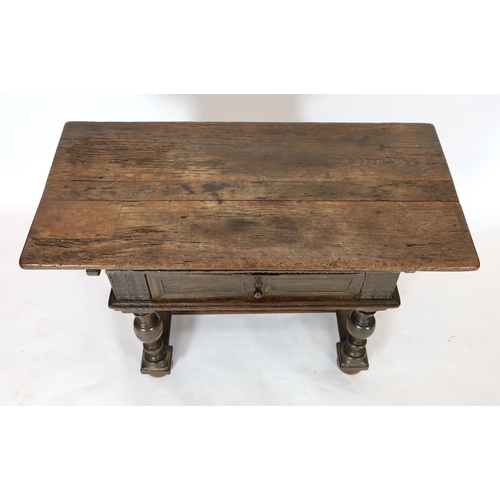 256 - A late 17th century Dutch oak side table, with rectangular top and frieze drawer, on baluster legs w... 