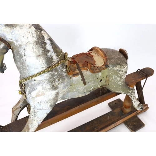 26 - A Victorian carved and painted wood rocking horse, with remnants of original dapple grey finish, lar... 