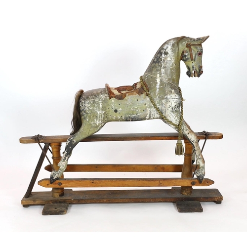 26 - A Victorian carved and painted wood rocking horse, with remnants of original dapple grey finish, lar... 