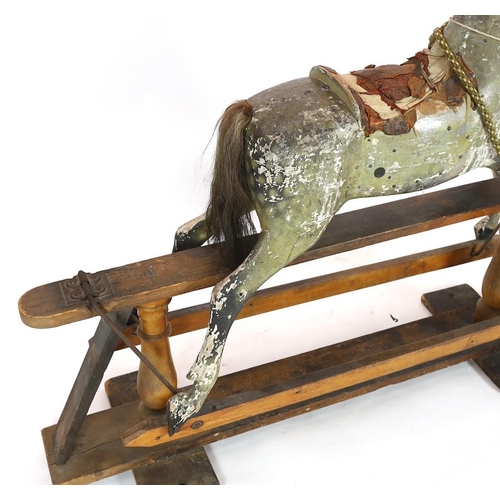 26 - A Victorian carved and painted wood rocking horse, with remnants of original dapple grey finish, lar... 