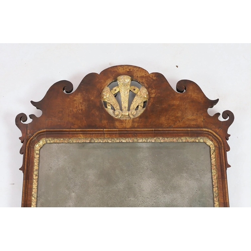 260 - A George II walnut and parcel gilt fret frame wall mirror, with Prince of Wales feathered crest and ... 