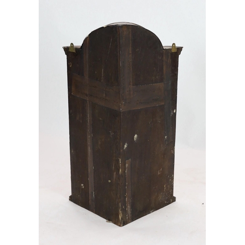 261 - A Queen Anne walnut hanging corner cupboard, with arched cornice and single arched door above a cand... 