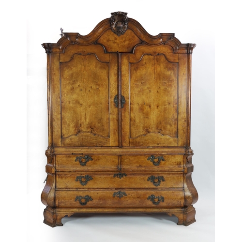 263 - An 18th century Dutch walnut armoire, with scroll moulded cornice and two panelled doors enclosing p... 