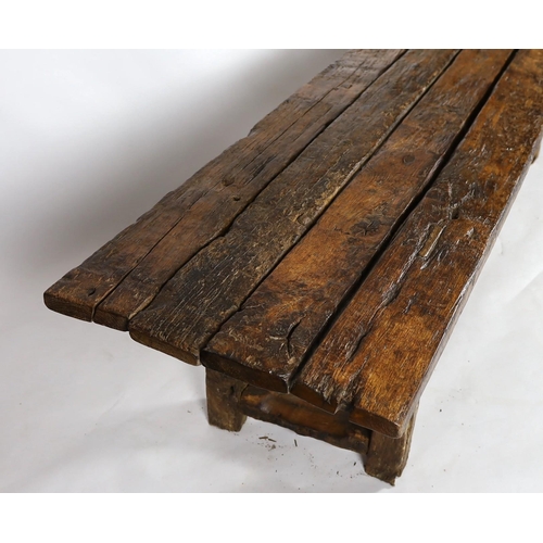 265 - A rustic oak four plank top refectory table, constructed from old floorboards and other timbers, on ... 