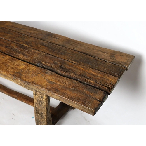 265 - A rustic oak four plank top refectory table, constructed from old floorboards and other timbers, on ... 