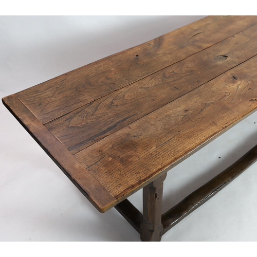 269 - A late 17th / 18th century oak and elm refectory table, with triple planked top, on octagonal legs w... 