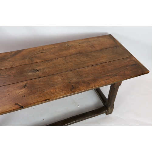 269 - A late 17th / 18th century oak and elm refectory table, with triple planked top, on octagonal legs w... 