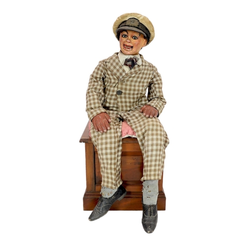 27 - A Leonard Insull ventriloquist's dummy, dressed in a check suit and wearing a sailor's cap, approx. ... 