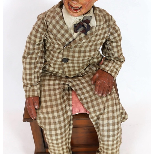 27 - A Leonard Insull ventriloquist's dummy, dressed in a check suit and wearing a sailor's cap, approx. ... 