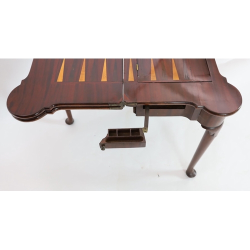 271 - A George II mahogany games table, with eared triple folding top opening to reveal a baize surface wi... 