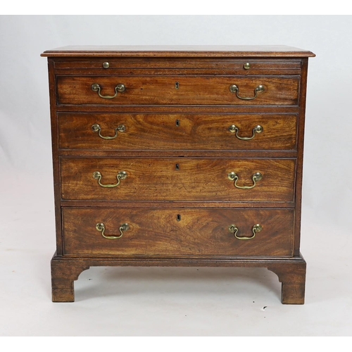 273 - A George III mahogany chest, with brushing slide and four graduated long drawers on bracket feet, wi... 