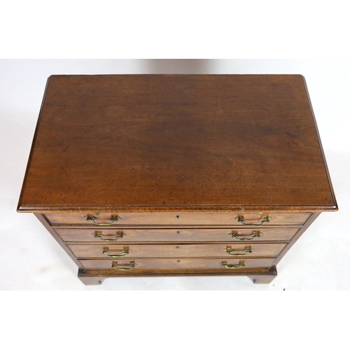 273 - A George III mahogany chest, with brushing slide and four graduated long drawers on bracket feet, wi... 