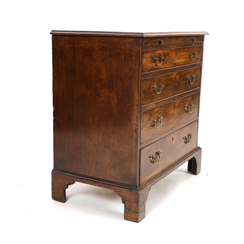 273 - A George III mahogany chest, with brushing slide and four graduated long drawers on bracket feet, wi... 