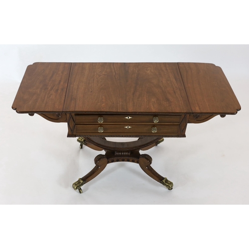 277 - Y Y A Regency mahogany drop leaf work table, with beaded rectangular top, scroll carved folding brac... 