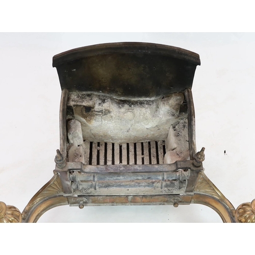 279 - A George III brass cast and wrought iron fire grate, with fluted ball finials and scroll feet, 102cm... 