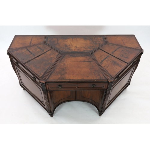 281 - An unusual George IV mahogany kneehole desk, of demi-octagonal form, with segmented leather lined to... 