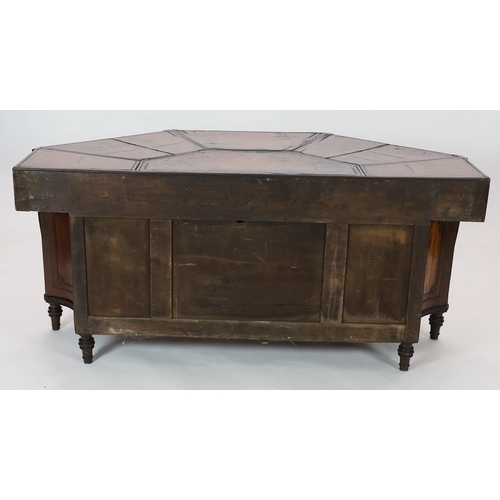 281 - An unusual George IV mahogany kneehole desk, of demi-octagonal form, with segmented leather lined to... 