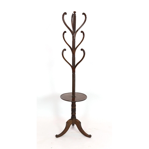 282 - A Regency mahogany hat stand, with central spiral twist column and nine scrolling arms over circular... 