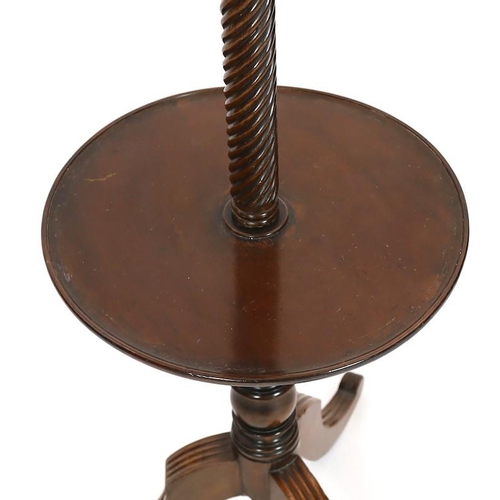 282 - A Regency mahogany hat stand, with central spiral twist column and nine scrolling arms over circular... 