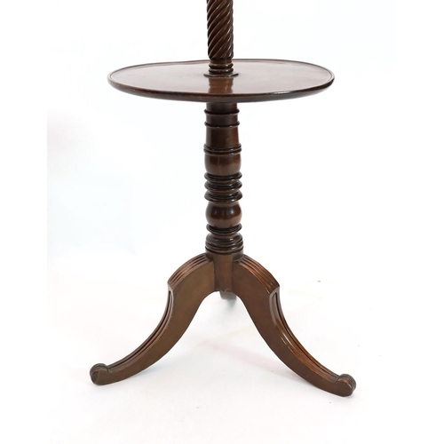 282 - A Regency mahogany hat stand, with central spiral twist column and nine scrolling arms over circular... 