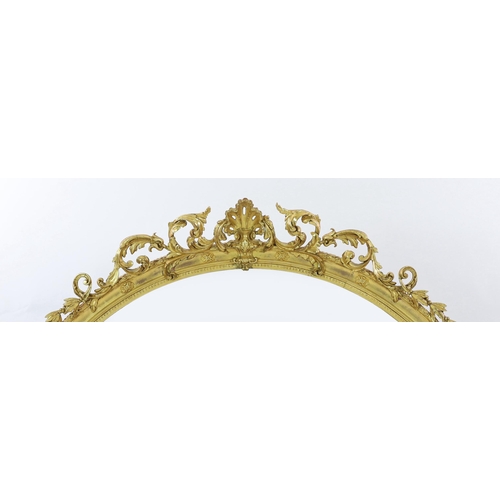 283 - A Victorian giltwood and gesso overmantel mirror, of ornate arched form with foliate scroll and shel... 