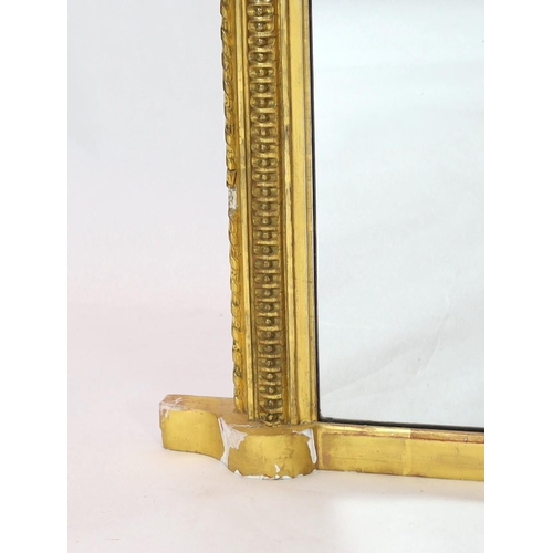 284 - A Victorian giltwood and gesso overmantel mirror, of arched form with foliate scroll crest and beade... 