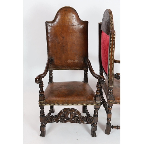 291 - A pair of late 17th century Spanish walnut and elm armchairs, with arched leather covered backs, mou... 