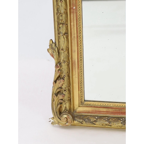 294 - A late 19th century French giltwood and gesso overmantel mirror, with flower, quiver and torch troph... 