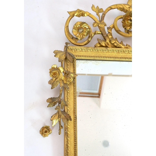 296 - A 19th century century carved giltwood wall mirror, with elaborate ornate eagle and flowering swag s... 