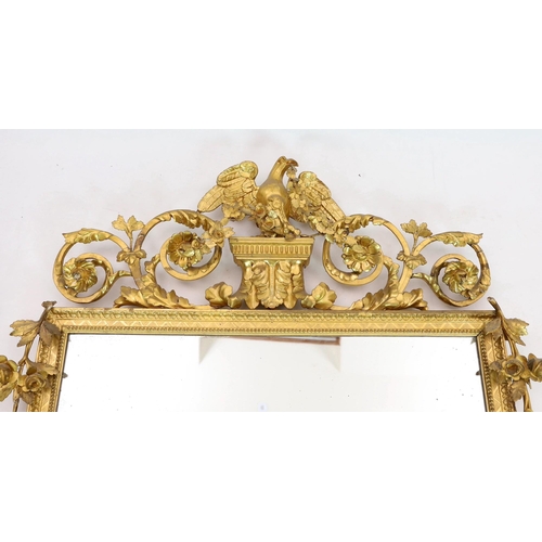 296 - A 19th century century carved giltwood wall mirror, with elaborate ornate eagle and flowering swag s... 