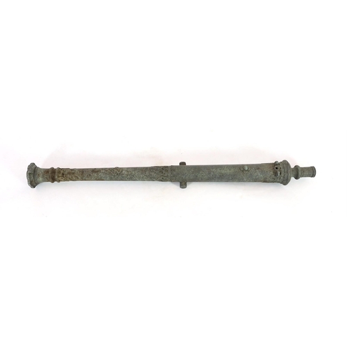 32 - An 18th century Indonesian bronze Lantaka cannon, inscription to the barrel, 125cm long