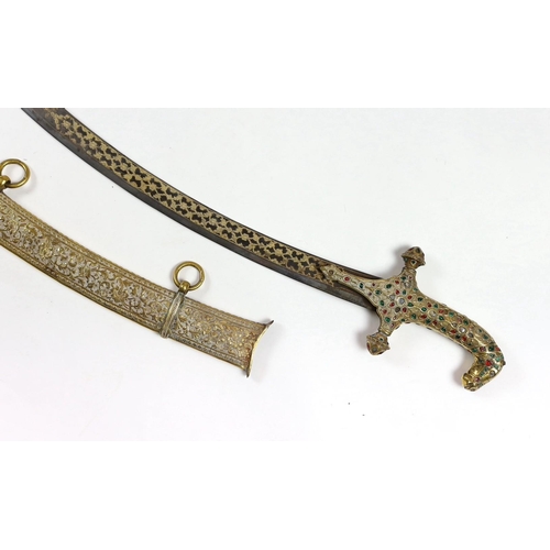 33 - A fine Indian gilt copper and paste mounted sword (shamshir), Kutch, 19th century, with bejewelled h... 