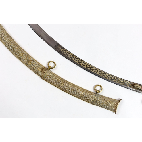 33 - A fine Indian gilt copper and paste mounted sword (shamshir), Kutch, 19th century, with bejewelled h... 