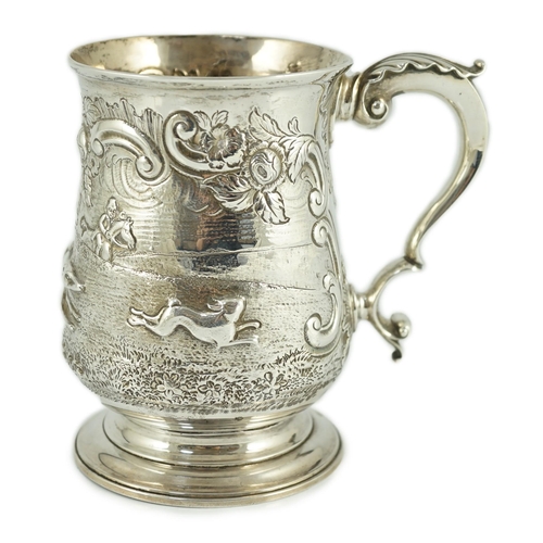 436 - A George III silver baluster mug, later embossed with continuous hare coursing scene, John Scofield,... 