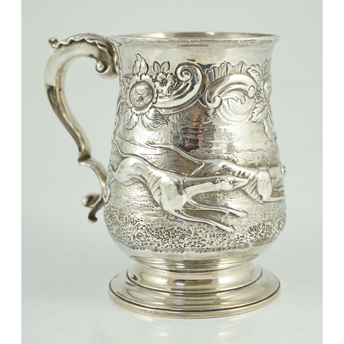 436 - A George III silver baluster mug, later embossed with continuous hare coursing scene, John Scofield,... 