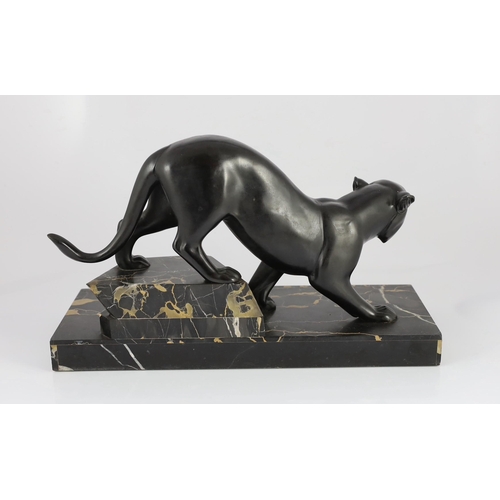 53 - Irene Rochard. A French Art Deco bronzed spelter and marble model of a black panther, standing upon ... 