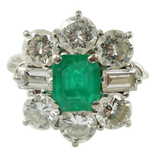 542 - A mid 20th century 18kt white gold, single stone emerald and round and baguette cut diamond cluster ... 