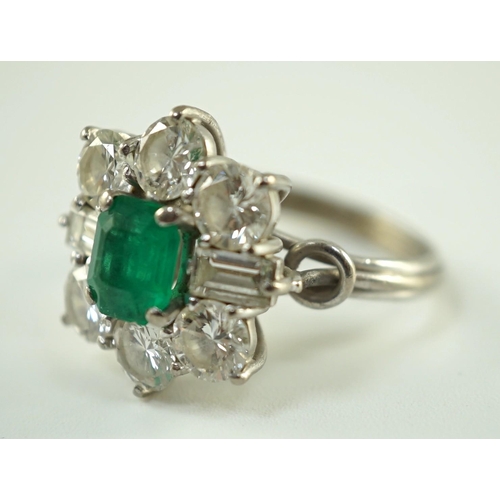 542 - A mid 20th century 18kt white gold, single stone emerald and round and baguette cut diamond cluster ... 