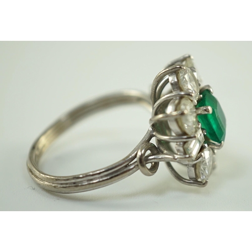 542 - A mid 20th century 18kt white gold, single stone emerald and round and baguette cut diamond cluster ... 