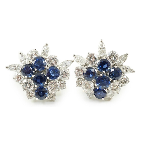 543 - A pair of modern 750 white gold, set sapphire and diamond cluster ear studs, each set with five roun... 