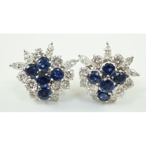 543 - A pair of modern 750 white gold, set sapphire and diamond cluster ear studs, each set with five roun... 