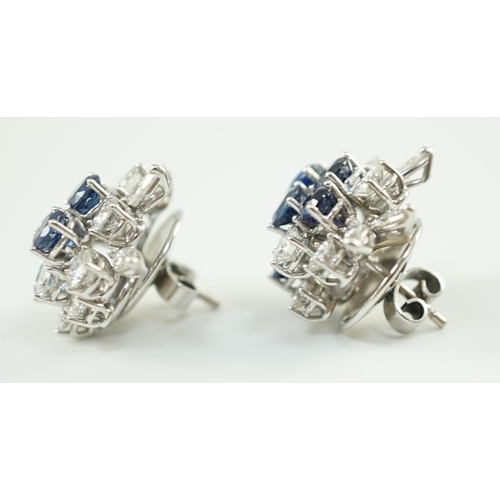 543 - A pair of modern 750 white gold, set sapphire and diamond cluster ear studs, each set with five roun... 